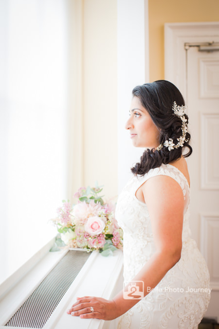 Bride getting ready, looking out of window