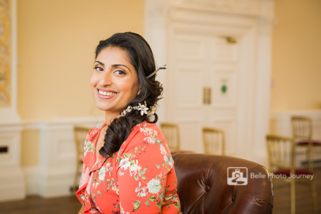 Happy bride at her bridal preparation - smiling at camera