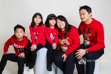 Family wearing christmas jumpers