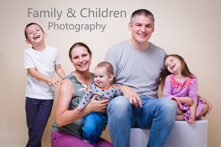 Family of five laughing - Crouch End photo studio