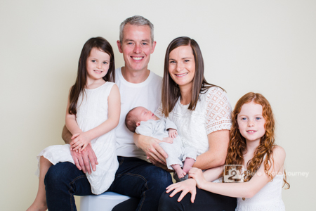 Family of five portrait with newborn baby