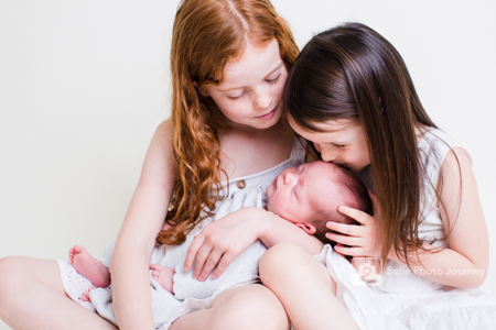 Newborn with siblings portrait photo crouch end photographer